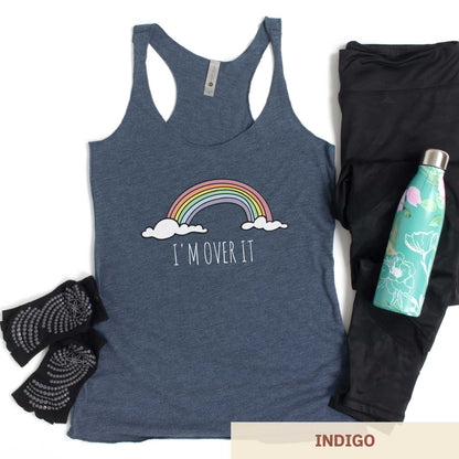 An indigo Next Level triblend racerback tank top featuring a rainbow and clouds and the words i'm over it.