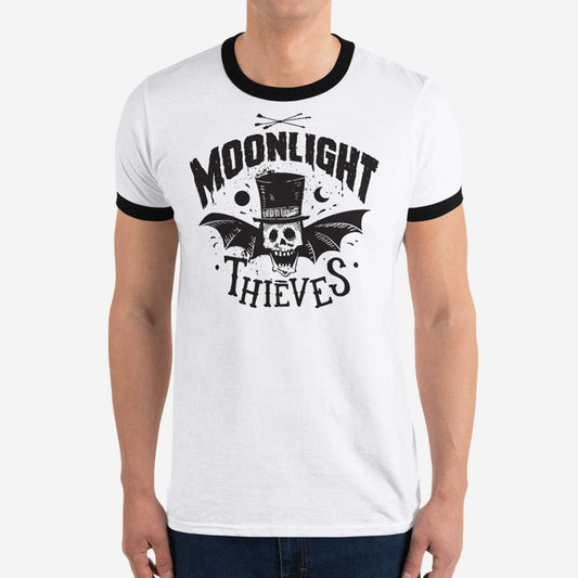 A man wearing a white classic ringer t-shirt with black bands featuring a sketch of a bat with a skeleton for a head and a top had and the words moonlight thieves.