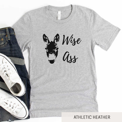 An athletic heather Bella Canvas t-shirt featuring a donkey and the words wise ass.