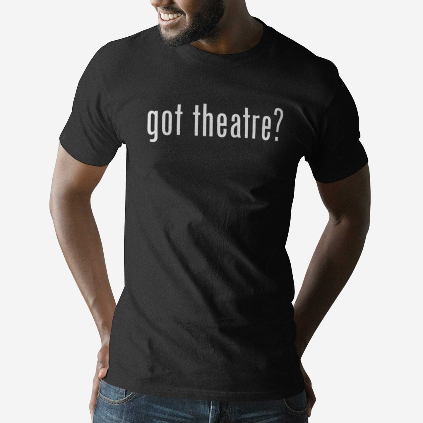 A man wearing a black Bella Canvas t-shirt with the words got theatre?