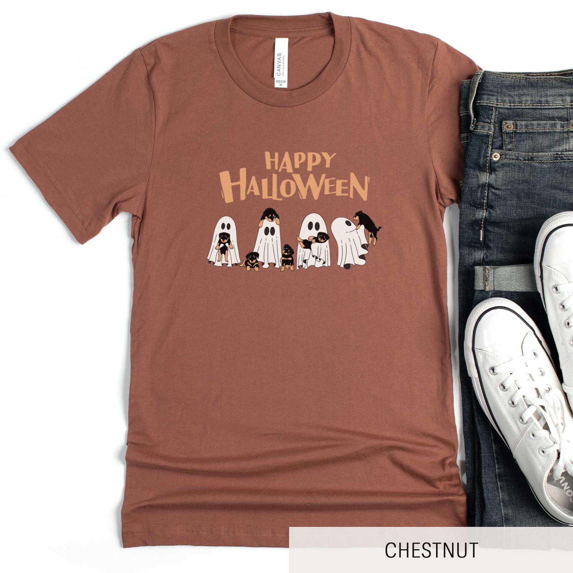 An autumn Bella Canvas t-shirt featuring four ghosts holding Beauceron puppies.