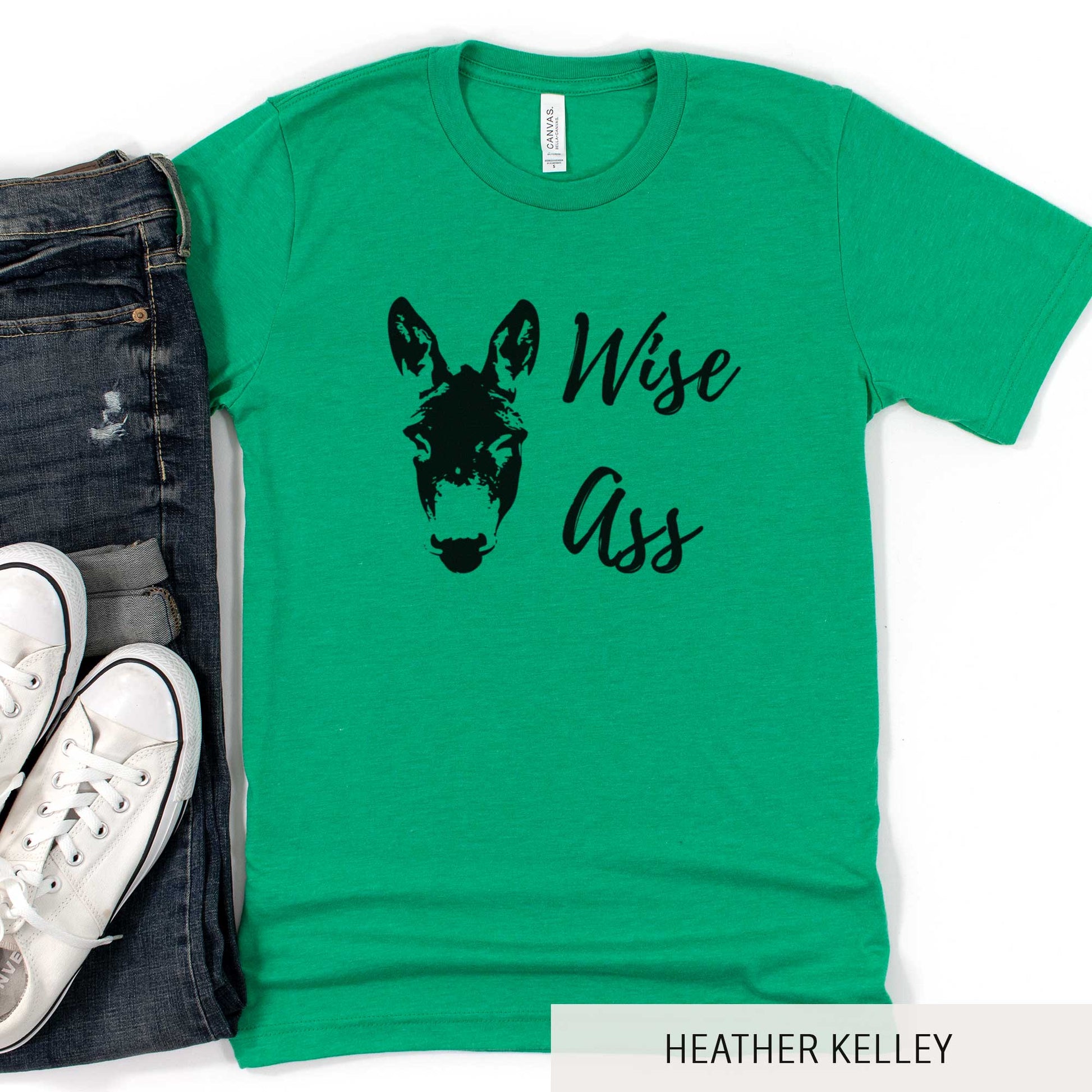 A heather kelly Bella Canvas t-shirt featuring a donkey and the words wise ass.