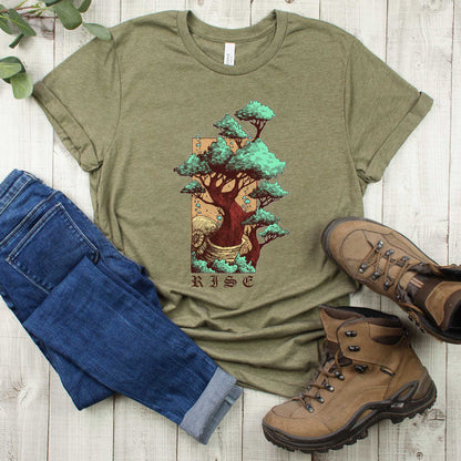 A heather olive Bella Canvas t-shirt featuring a bonsai tree illustration with the words rise below it.