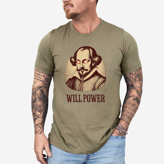 A man wearing a heather olive Bella Canvas t-shirt featuring a woodcut of William Shakespeare with glowing superhero eyes and the words Will Power.