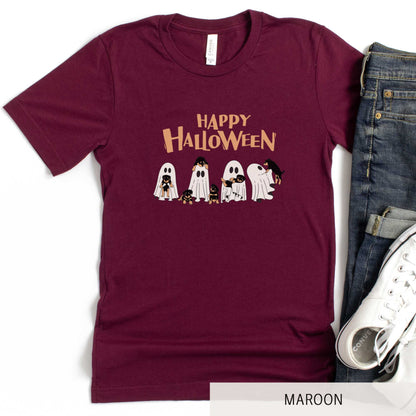 A maroon Bella Canvas t-shirt featuring four ghosts holding Beauceron puppies.