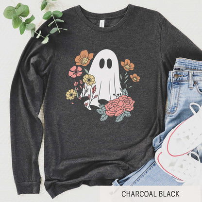 A long sleeve charcoal black triblend Bella Canvas t-shirt featuring a cartoon ghost with flowers around it.