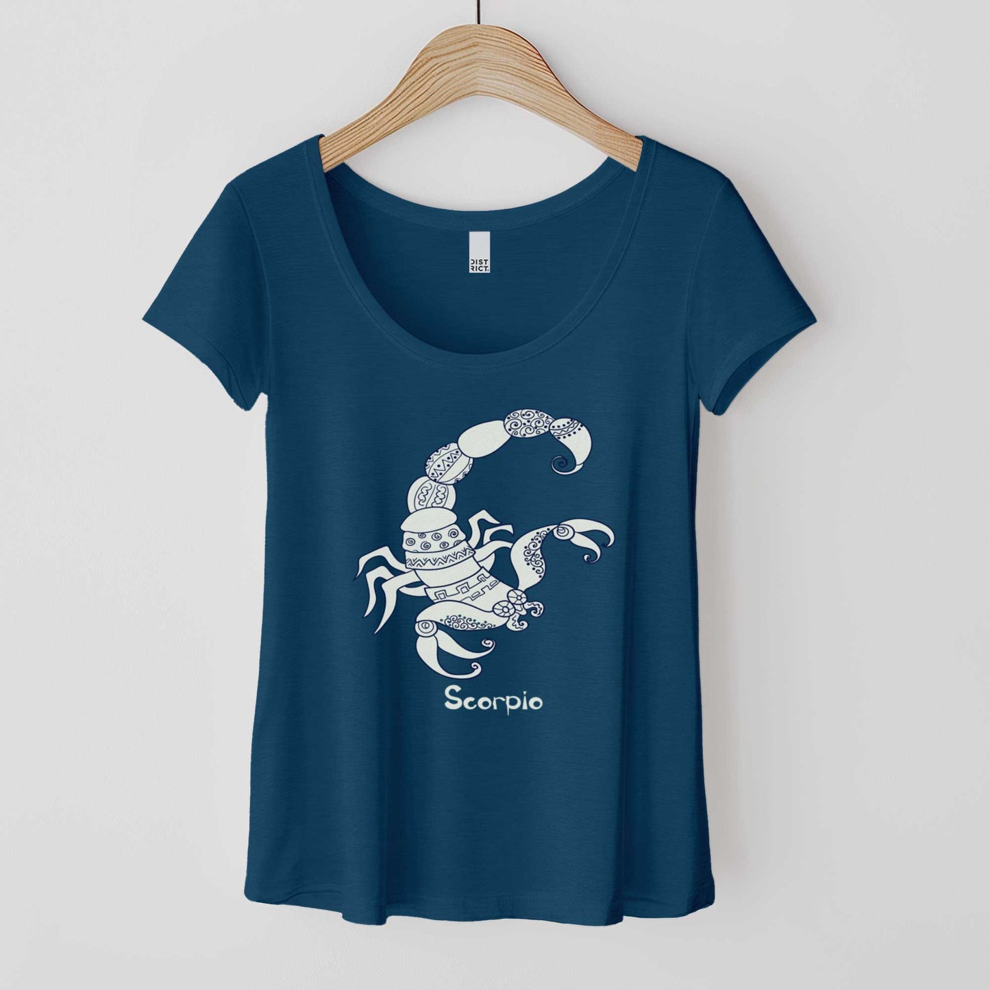 A hanging heathered neptune District 7501 scoop neck t-shirt featuring the zodiac symbol of Scorpio, the scorpion, in a Mediterranean style.