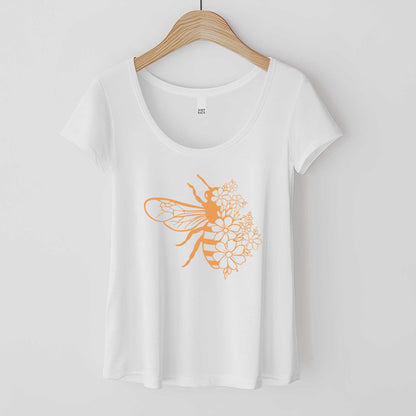 A white District 7501 scoop neck t-shirt featuring a bee illustration that is half made of pretty flowers.