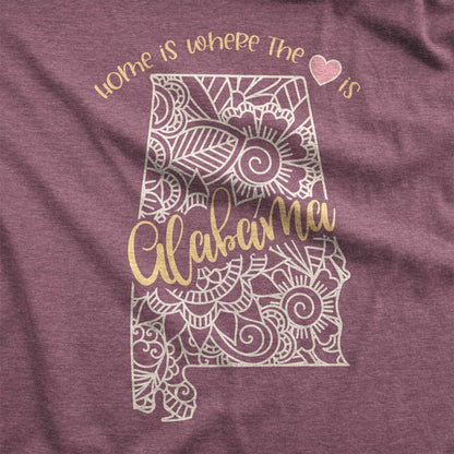 A heather maroon Bella Canvas swatch featuring a mandala in the shape of Alabama with the words home is where the heart is.